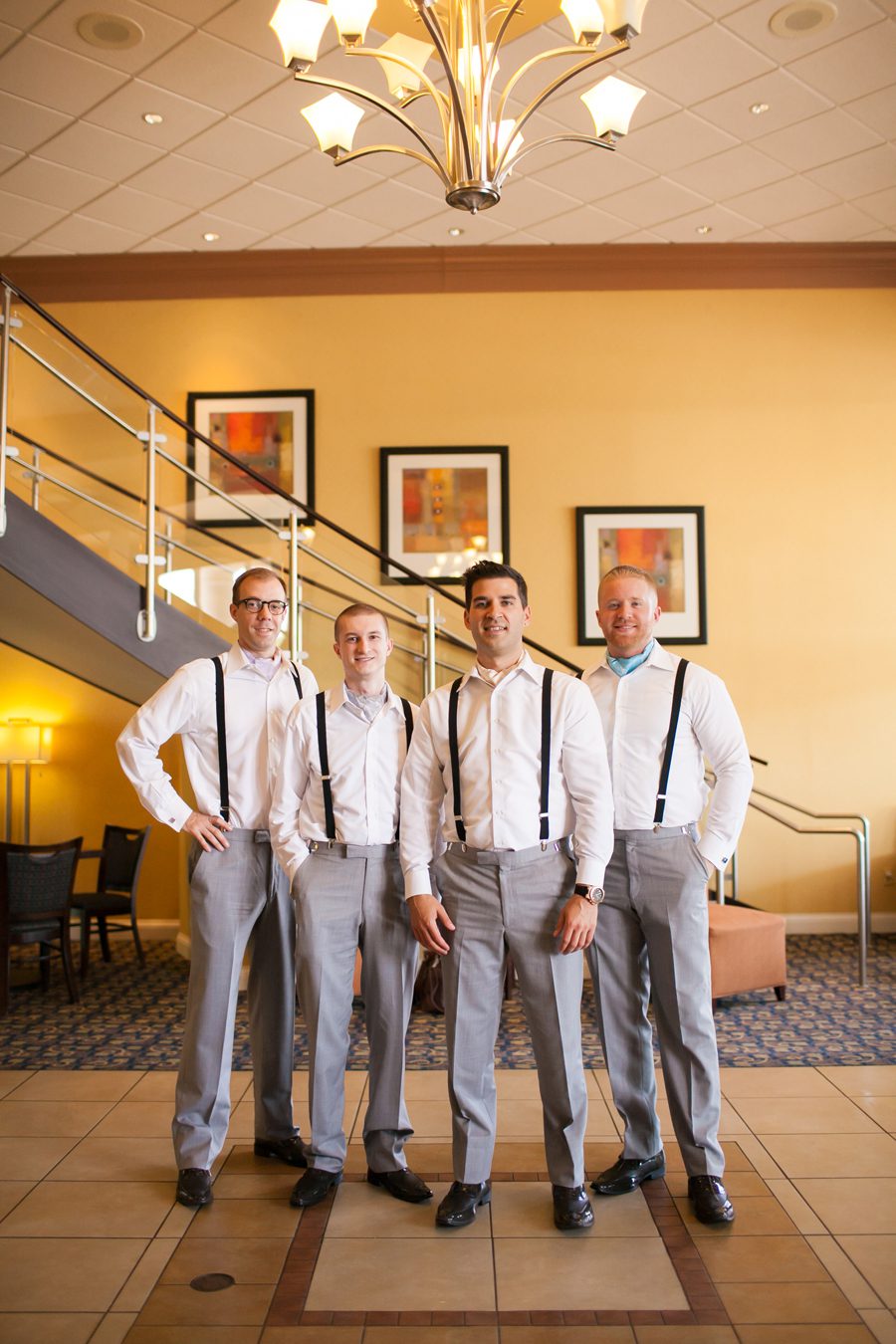groomsmen in ascots - hotel lobby