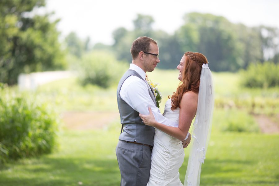 bride and groom see each other for the first time on their day {heritage prairie farm first look}