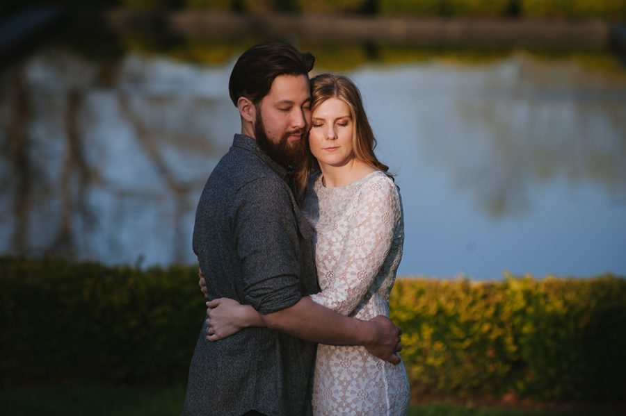couple hugging in front of the water {cantigny engagement photo}
