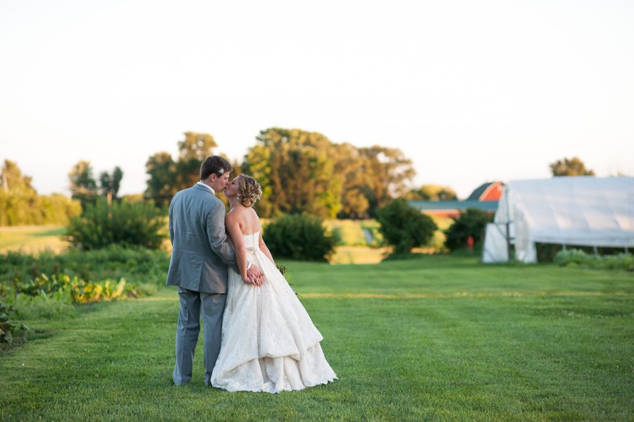 bride and groom kissing at sunset {Heritage Prairie Farm Photographer}