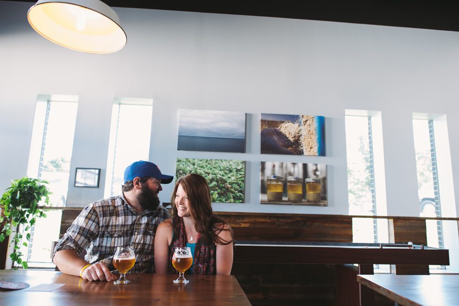 Couple laughing - Engagement photography at Penrose Brewing in Geneva, IL