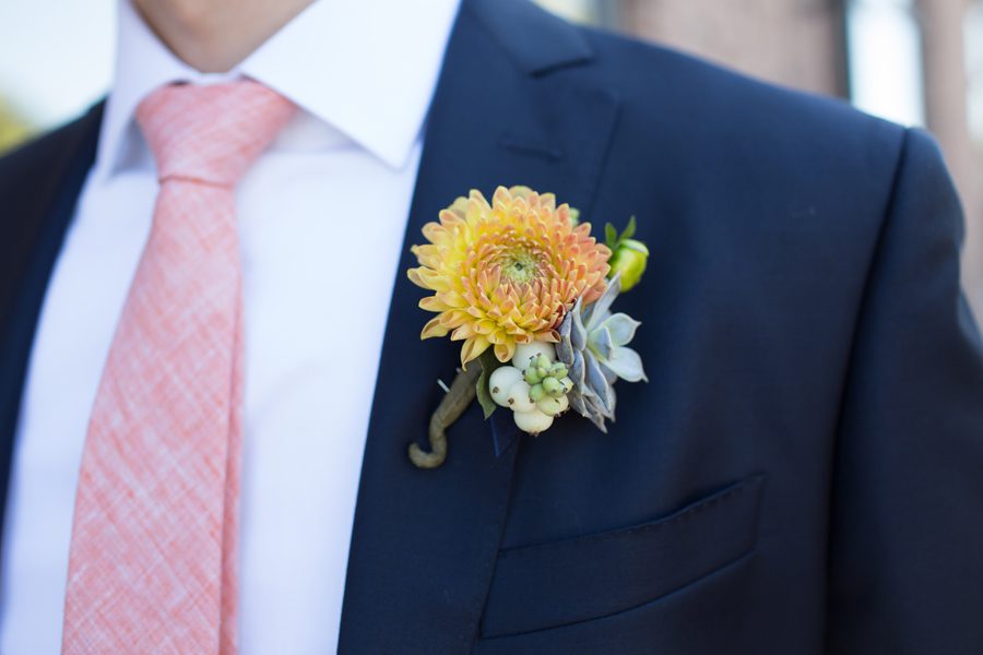 boutonniere for the groom with dahlia and succulent  
